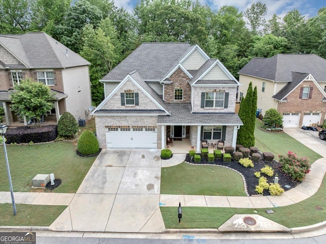 2376 Roberts View Trl, Buford, GA 30519 - craftsman-style home featuring a porch, an attached garage, a front lawn, and driveway