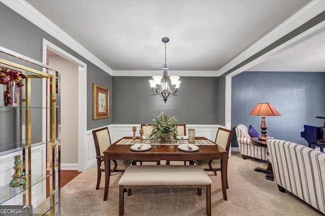 2376 Roberts View Trl, Buford, GA 30519 - dining area with an inviting chandelier, wainscoting, and crown molding