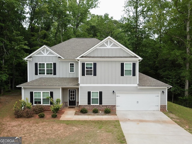 craftsman house featuring board and batten siding, roof with shingles, a garage, brick siding, and concrete driveway
