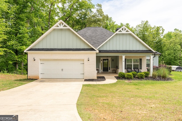 craftsman inspired home with a front yard, a shingled roof, board and batten siding, an attached garage, and driveway
