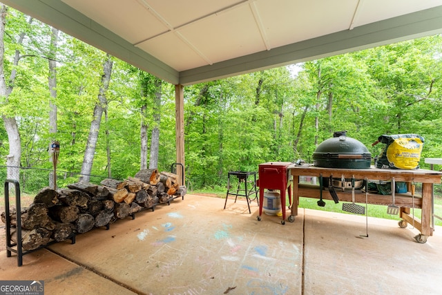 view of patio featuring a wooded view