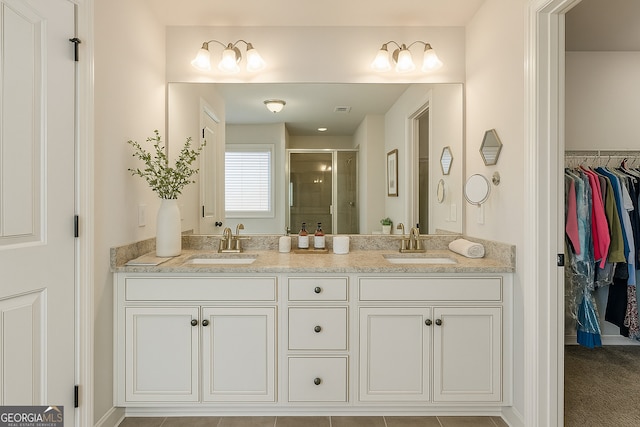 97 Fieldstone Ln, Dallas, GA 30132 - full bathroom with a stall shower, double vanity, and a spacious closet