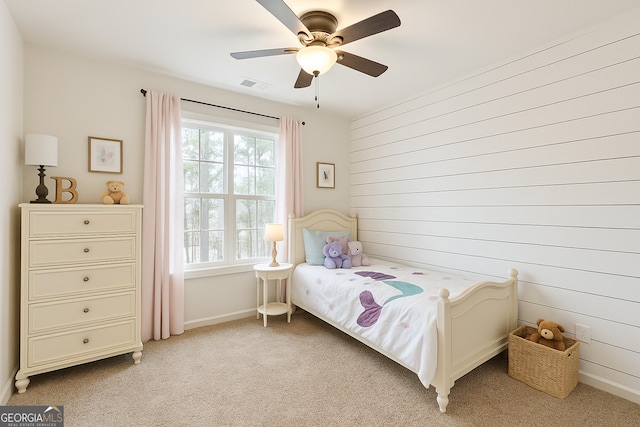 97 Fieldstone Ln, Dallas, GA 30132 - bedroom featuring light colored carpet, baseboards, wood walls, and ceiling fan