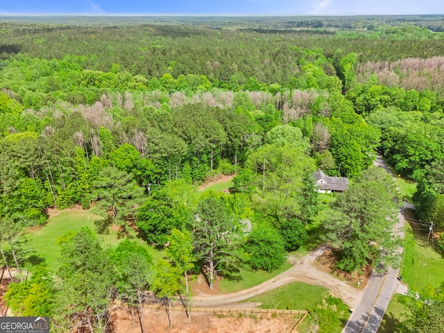 drone / aerial view featuring a view of trees