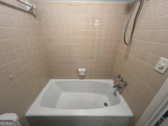 full bath featuring shower / bath combination and toilet