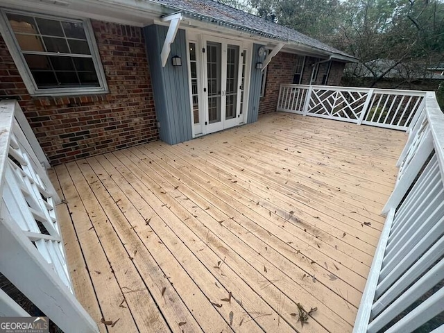 wooden deck featuring french doors