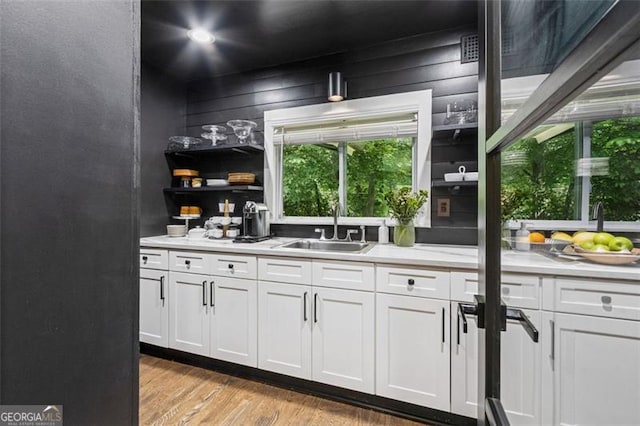 5785 Timberlane Ter, Sandy Springs, GA 30328 - bar featuring plenty of natural light, a sink, and light wood-style flooring
