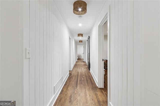 5785 Timberlane Ter, Sandy Springs, GA 30328 - hallway with visible vents, crown molding, wood walls, dark wood finished floors, and baseboards