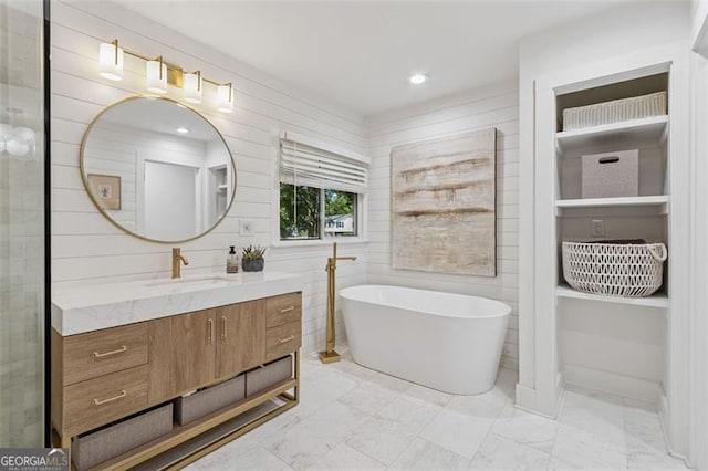 5785 Timberlane Ter, Sandy Springs, GA 30328 - bathroom with recessed lighting, a freestanding bath, marble finish floor, and vanity