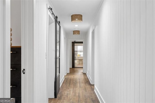 5785 Timberlane Ter, Sandy Springs, GA 30328 - corridor featuring a barn door and wood finished floors