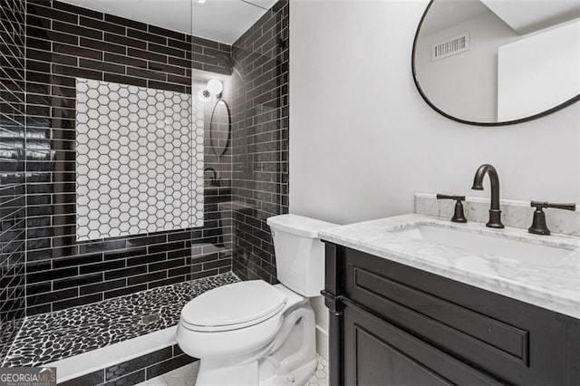 5785 Timberlane Ter, Sandy Springs, GA 30328 - full bathroom featuring vanity, toilet, tiled shower, and visible vents