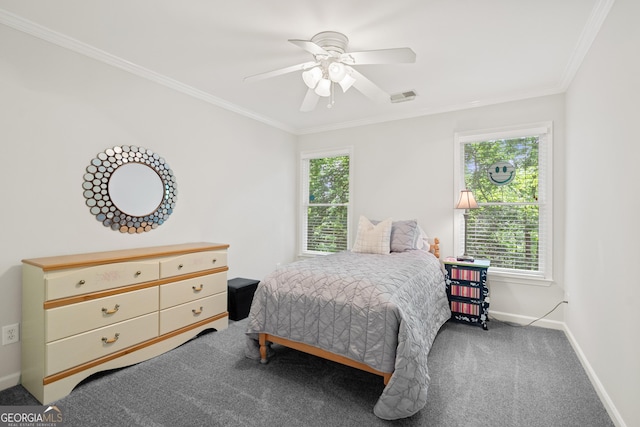 carpeted bedroom with baseboards, visible vents, ornamental molding, and ceiling fan