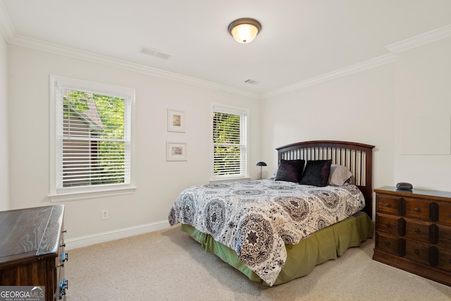 bedroom with crown molding, carpet flooring, baseboards, and visible vents