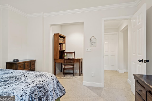 bedroom featuring crown molding, baseboards, and light carpet