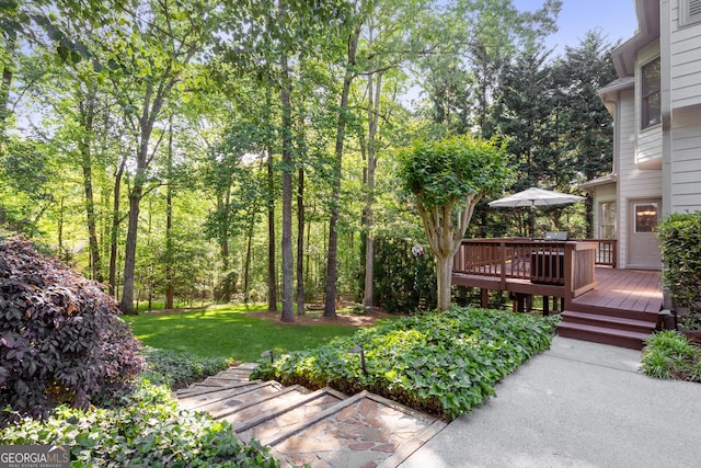 view of yard with a wooden deck