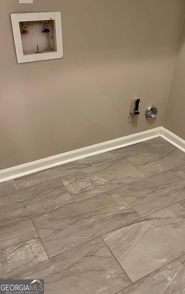 laundry room with baseboards, hookup for a washing machine, and marble finish floors