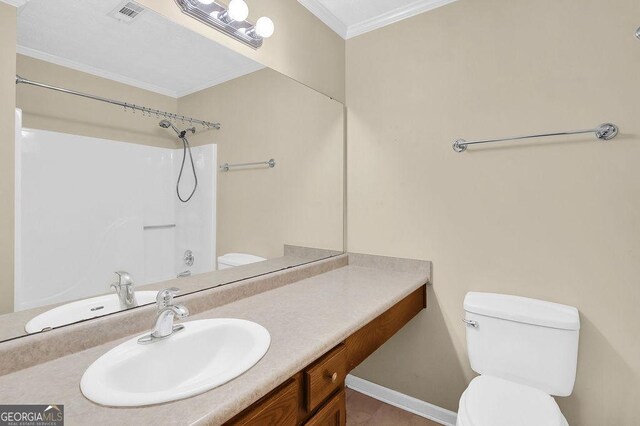full bathroom with toilet, vanity, crown molding, and baseboards