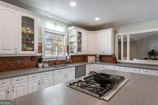 kitchen featuring a sink, appliances with stainless steel finishes, and white cabinets