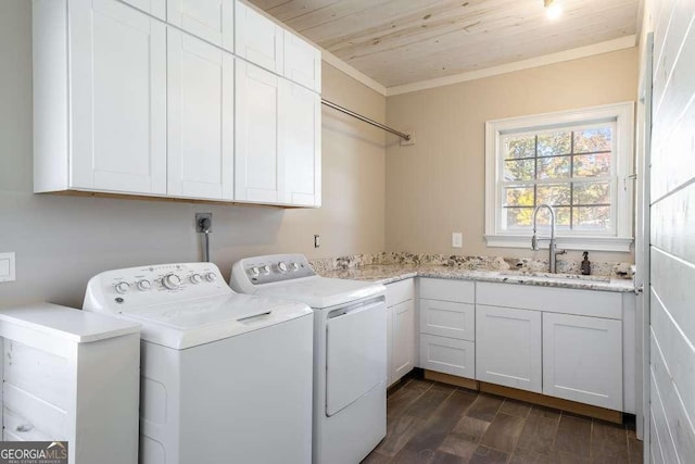 clothes washing area with wood ceiling, washing machine and clothes dryer, cabinet space, a sink, and ornamental molding
