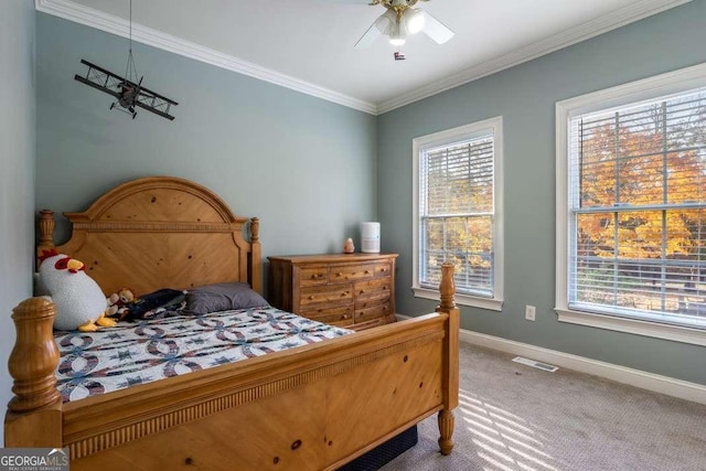 bedroom featuring ceiling fan, carpet, baseboards, visible vents, and ornamental molding