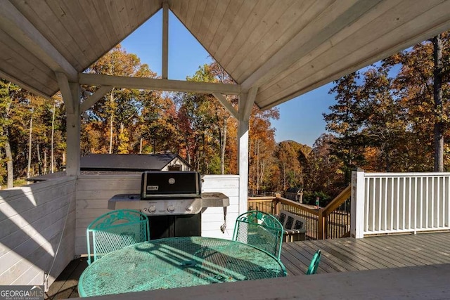 deck with outdoor dining area