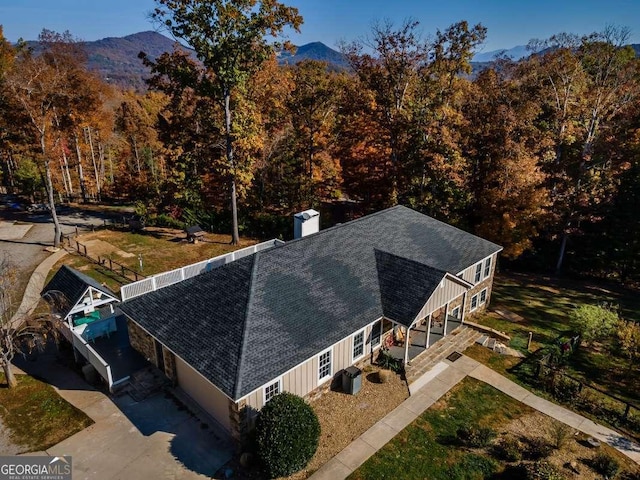 birds eye view of property with a mountain view
