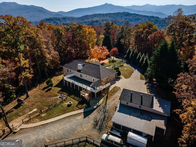 bird's eye view featuring a view of trees and a mountain view