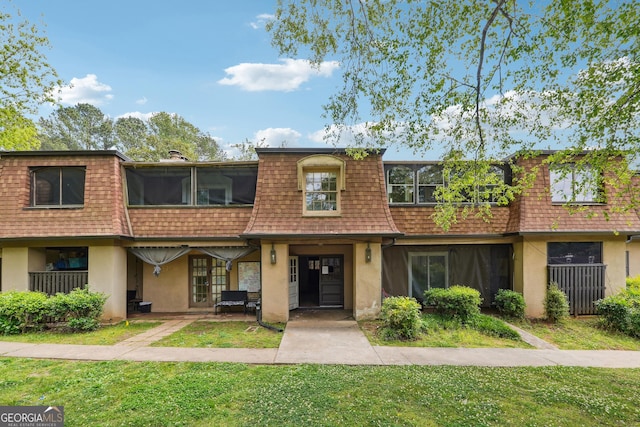 2930 Parc Lorraine, Lithonia, GA 30038 - view of front of home with a front lawn, stucco siding, and mansard roof
