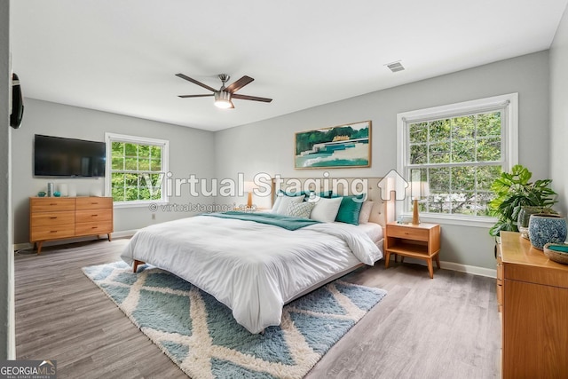 2930 Parc Lorraine, Lithonia, GA 30038 - empty room featuring a ceiling fan, baseboards, visible vents, and wood finished floors
