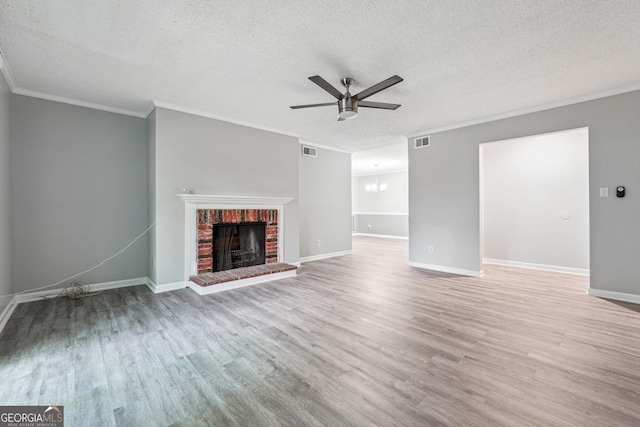 2930 Parc Lorraine, Lithonia, GA 30038 - unfurnished living room with a textured ceiling, ornamental molding, a ceiling fan, and wood finished floors
