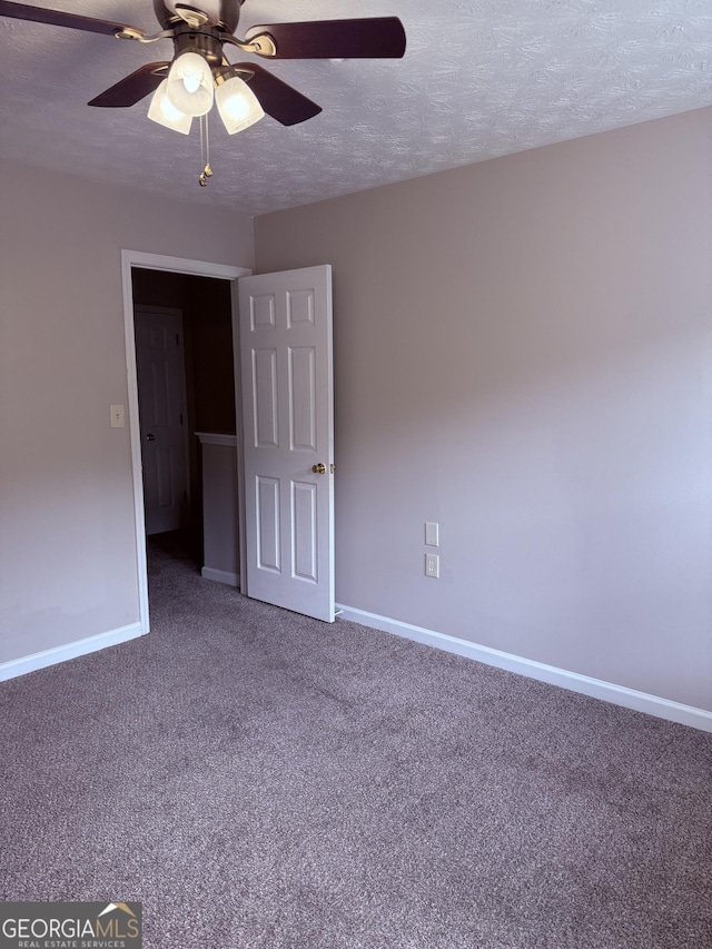 6433 Wellington Chase Ct, Lithonia, GA 30058 - empty room featuring ceiling fan, carpet flooring, and a textured ceiling