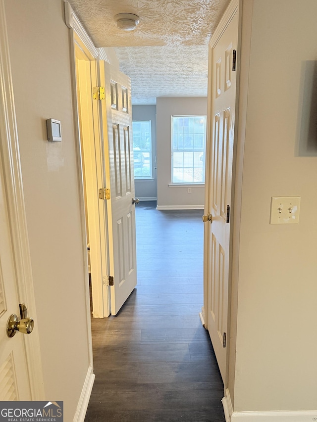 6433 Wellington Chase Ct, Lithonia, GA 30058 - hallway featuring baseboards and dark wood-type flooring