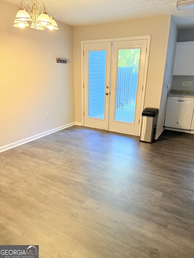 6433 Wellington Chase Ct, Lithonia, GA 30058 - unfurnished dining area featuring baseboards, a notable chandelier, french doors, and dark wood-type flooring