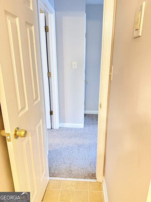 6433 Wellington Chase Ct, Lithonia, GA 30058 - hall with baseboards, light carpet, and light tile patterned flooring