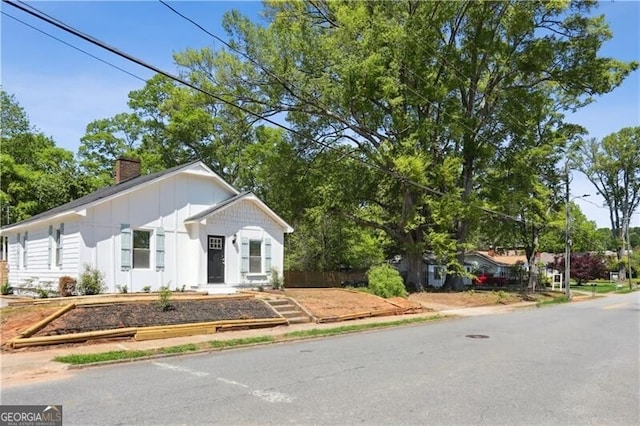 130 S Avenue SE, Marietta, GA 30060 - view of front of home featuring board and batten siding and a chimney