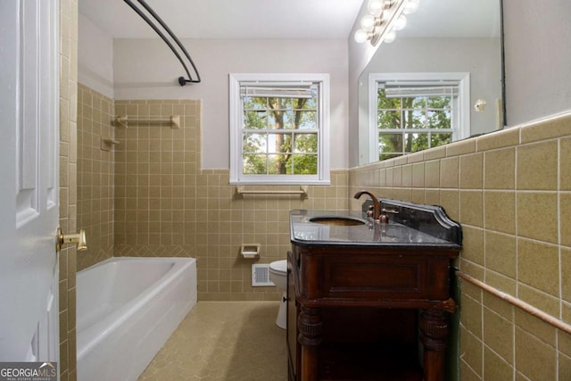 full bathroom featuring shower / bathing tub combination, visible vents, tile walls, vanity, and toilet