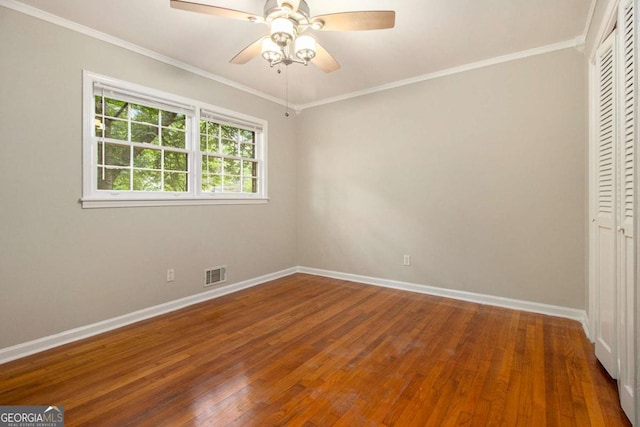 interior space with baseboards, visible vents, wood finished floors, and a closet