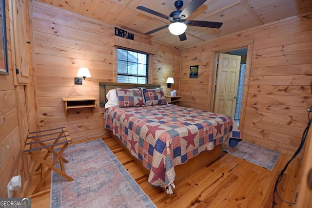 bedroom featuring wooden walls, wooden ceiling, and hardwood / wood-style floors