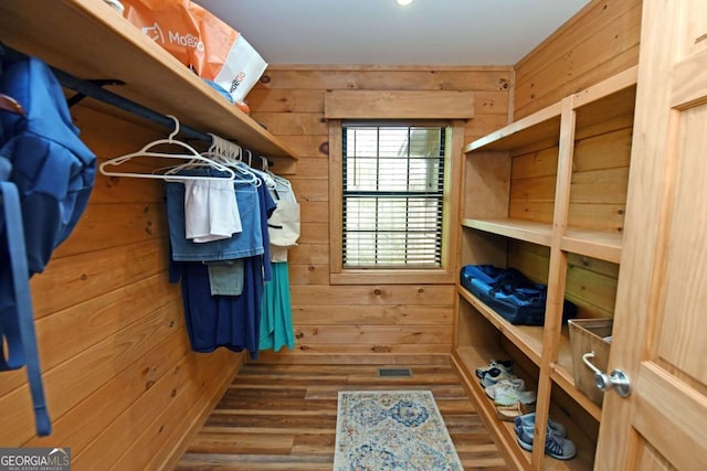 spacious closet with wood finished floors