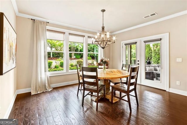 dining space featuring french doors, dark wood-style flooring, visible vents, baseboards, and a chandelier