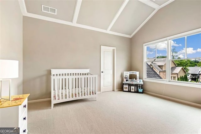 bedroom with carpet floors, baseboards, visible vents, and a crib
