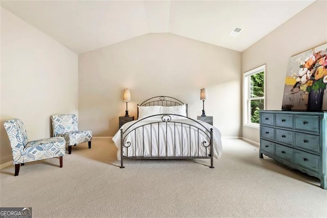 bedroom with baseboards, carpet, lofted ceiling, and visible vents