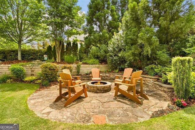 view of patio / terrace with an outdoor fire pit