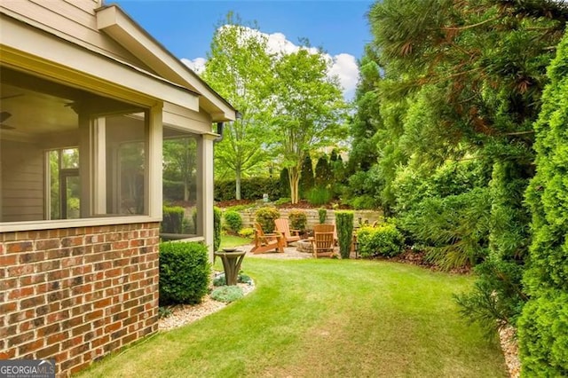 view of yard with a sunroom