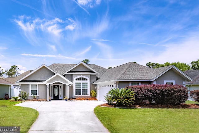 103 Donegal Ln, Kingsland, GA 31548 - single story home featuring a front lawn, stucco siding, a shingled roof, concrete driveway, and an attached garage