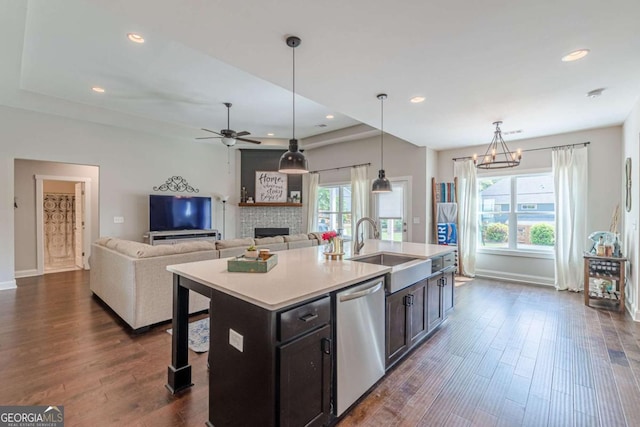 21 E Field St, Newnan, GA 30263 - kitchen featuring a sink, baseboards, a stone fireplace, and dishwasher