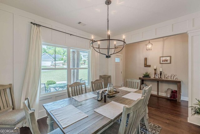 21 E Field St, Newnan, GA 30263 - dining space with an inviting chandelier, dark wood finished floors, and visible vents