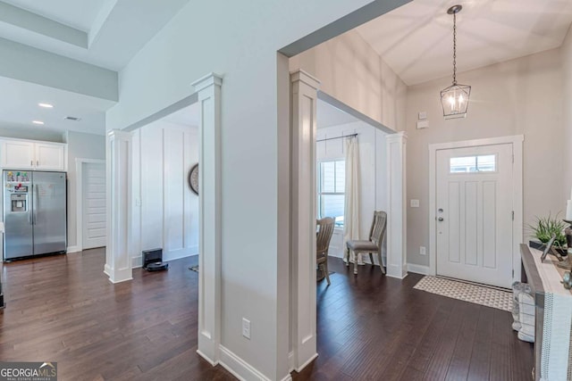 21 E Field St, Newnan, GA 30263 - entrance foyer with plenty of natural light, a chandelier, and dark wood-style floors