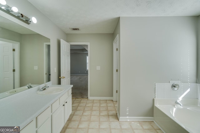 981 Charles Hall Dr, Dacula, GA 30019 - full bathroom featuring visible vents, vanity, baseboards, tile patterned floors, and a bath