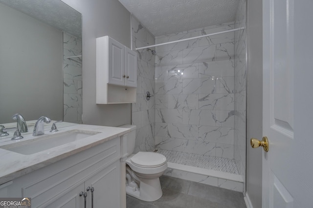 981 Charles Hall Dr, Dacula, GA 30019 - bathroom featuring vanity, a shower stall, and a textured ceiling